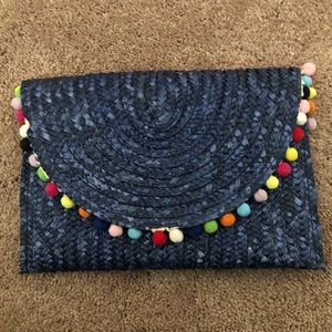 Navy straw and Pom Pom clutch